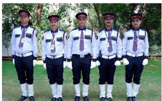 A.S.S. Security guards standing in line in formal cap and tie uniform