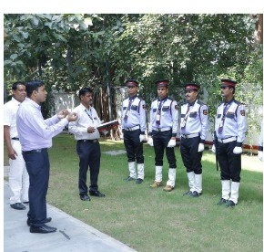 A.S.S. Security officer briefing a line of guards outdoors